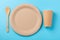 Eco-friendly biodegradable dishes on a blue background