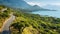 Eco-friendly Craftsmanship: Scenic Winding Road Through Trees Over Lake In Crete