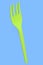 Eco-friendly disposable utensils like fork on blue background.