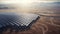 Eco-Friendly Energy Harvest: Aerial Sunrise Over Desert Solar Panel Farm