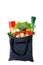 Eco-friendly gray reusable shopping bag filled with different fruits, vegetables and pasta