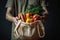 Eco-Friendly Grocery Shopping. Man Holding Cotton Bag with Vegetables.