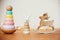 Eco friendly plastic free christmas gifts for toddler. Stylish wooden toys for child on wooden table. Modern colorful wooden