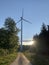 Eco-friendly windmill with spinning blades generates electricity, the concept of modern global technologies, environmental