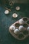 Eco friendly wooden egg holder with raw organic eggs on dark rustic background. Close up. Zero waste housekeeping