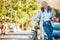 Eco friendly, worker travel and bike break outside in city. Business woman commuting with bicycle to reduce carbon