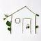 Eco house: symbol for green building and nature architecture. Symbol of the house is lined with green twigs with leaves.