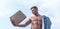 Eco package. Sales season. Shop assistant concept. Man muscular athlete hold shopping bag sky background. Hot sales and
