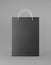 Eco packaging mockup bag kraft paper with handle front side. Standard medium black template on gray background promotional