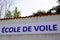 Ecole de voile French text means sailing school logo brand and sign text on facade building