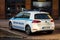 Ecologic and electric VW e-Golf police car of the Ostrava town police department parked in front of a store