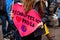 Ecological activist holds sign at rally