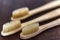 Ecological bamboo toothbrushes on wooden table