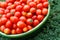 Ecological cherry tomatoes in a basin