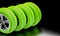 Ecological green tires on dark background