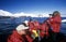 Ecological tourists from cruise ship Marco Polo in inflatable Zodiac boat at Paradise Harbor, Antarctica