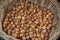 Ecological walnuts in a wicker basket for sale at farmer\\\'s market, autumn harvest, healthy food
