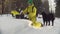 Ecologist in winter forest getting sampels of the snow