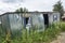 Ecology. The abandoned broken-down construction booth was overgrown with grass.