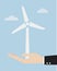 Ecology concept with hand give wind power station