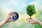 Ecology concept human hands holding big plant face tree look world environment,Earth image provided by Nasa.