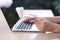 Ecommerce concept, Woman using credit card with ecommerce website via laptop on wooden desk