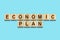 Economic, Plan. The inscription on wooden blocks on a blue background. Plan for overcoming the crisis. Business.