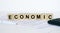 Economic word concept written on wooden cubes blocks