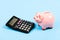 Economics and business administration. Piggy bank money savings. Investing gain profit. Piggy bank pig and calculator