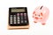 Economics and profit management. Economics and finance. Piggy bank pink pig and calculator. Exchange rates. Economics