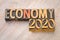 Economy 2020 word abstract in wood type