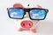 Economy and finance - piggy bank with glasses and dreamed house