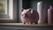 Economy savings concept. Cute pink piggy bank standing in a moody light
