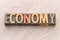 Economy word abstract in wood type