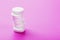 Ecstasy pills in a row on a pink background, isolate