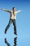 Ecstatic businessman jumping i