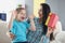 Ecstatic happy mom with daughter hold gift box closeup