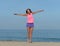 Ecstatic happy woman on beach