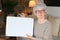 Ecstatic senior woman holding a briefcase