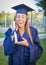 Ecstatic Teen Holding Diploma in Cap and Gown