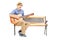 Ecstatic young guitarist sitting on bench and singing