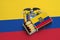 Ecuador flag is shown in an open matchbox, which is filled with matches and lies on a large flag