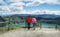 Ecuadorian ethnic couple looking at view of majestic lagoon in Quilotoa caldera in Quilotoa, Ecuador.