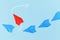 Ed paper airplane flying out of line of blue airplanes. Concept for new business strategies, leadership, discovery, difference