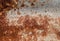 Ed Rust on the wall of the container Metal Decayed Crumpled Sheet Wide Background. Weathered Iron Rusty Isolated Metallic Texture