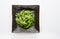 Edamame green soybeans in the bowl, fried green soybeans with salt in a black bowl on white background