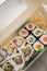 Edamame, salmon, surimi, cucumber and avocado Maki and inside out California sushi with soy sauce, pickled ginger, wasabi and soy