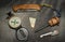 EDC. Wearable survival kit. Folding knife, compass and hunting matches with flint. Tools for overnight in the forest. Tools for