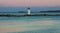 Edgartown Lighthouse Banner at Twilight surrounded by Water