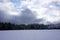 edge of the forest in winter on a cold day with impressive cloud play